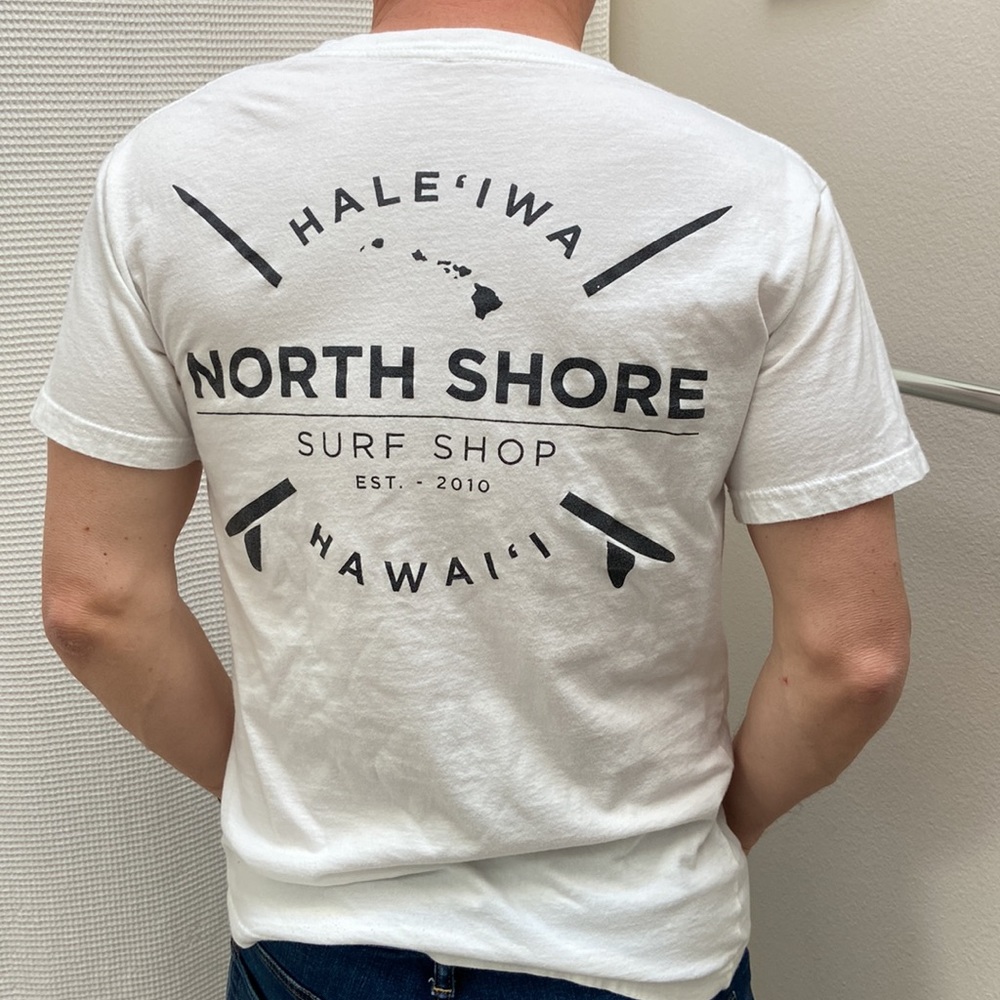 Men’s Hale’iwa North Shore Surf Shop white t-shirt with black design. No size.